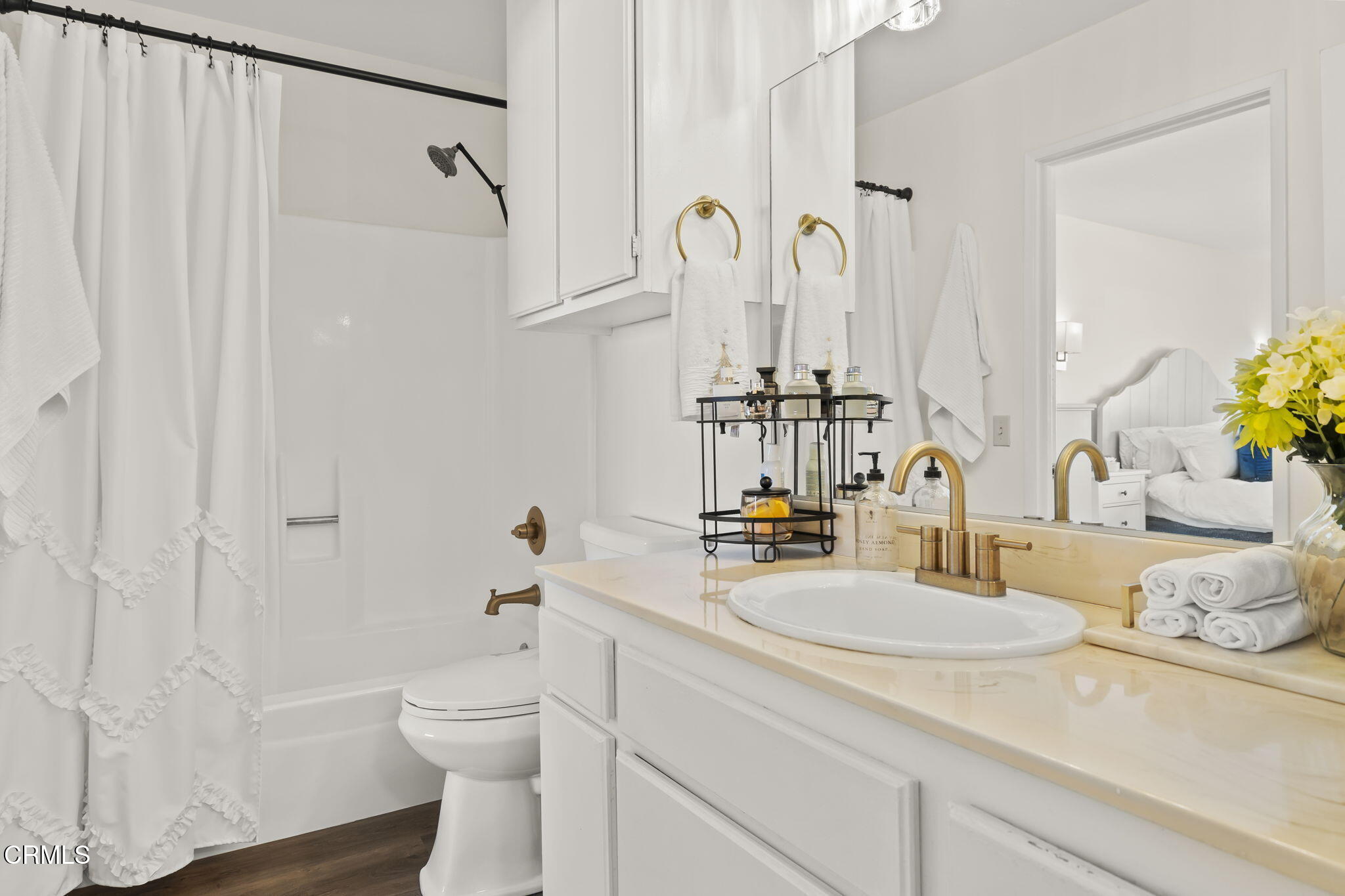 3255 Kelp Lane Oxnard, CA 93035 - Photo 5 of 45 a bathroom with a granite countertop sink a toilet and a mirror
