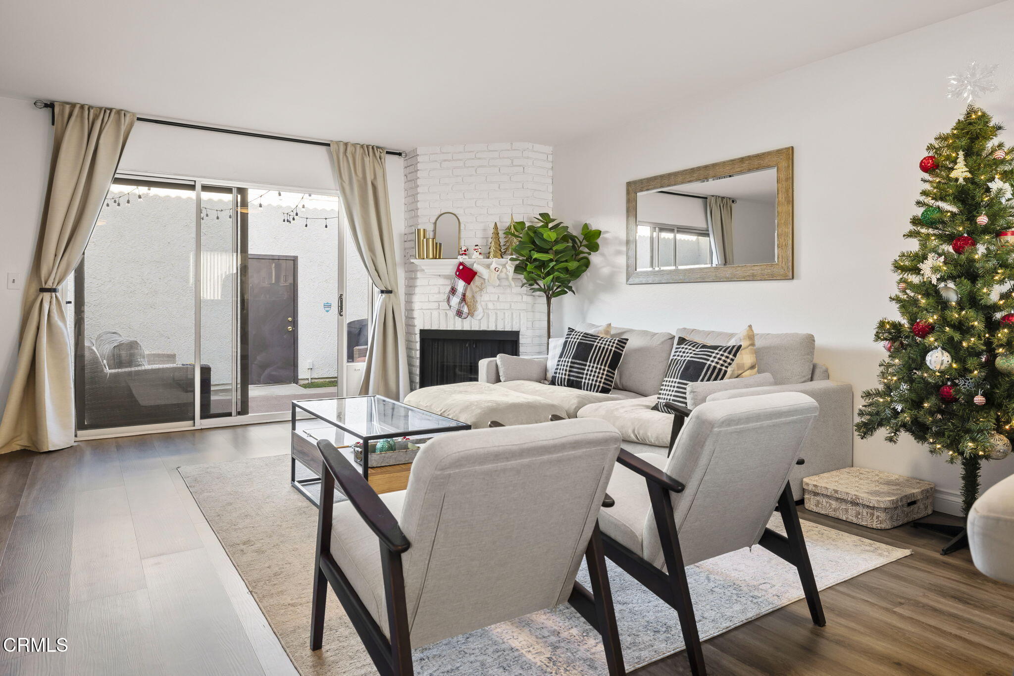3255 Kelp Lane Oxnard, CA 93035 - Photo 7 of 45 a living room with furniture a potted plant and a large window