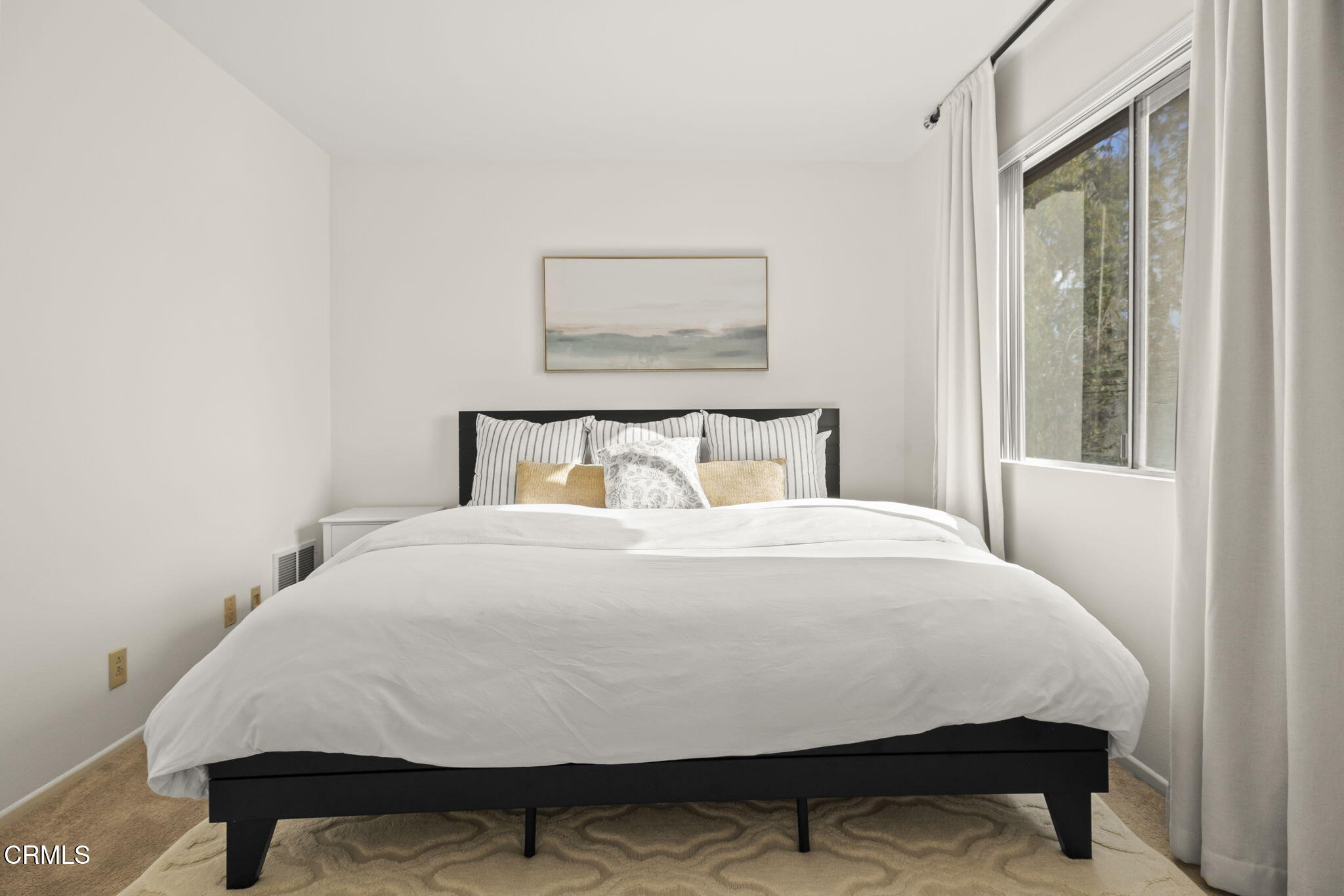 3255 Kelp Lane Oxnard, CA 93035 - Photo 10 of 45 a large bed sitting in a bedroom next to a window