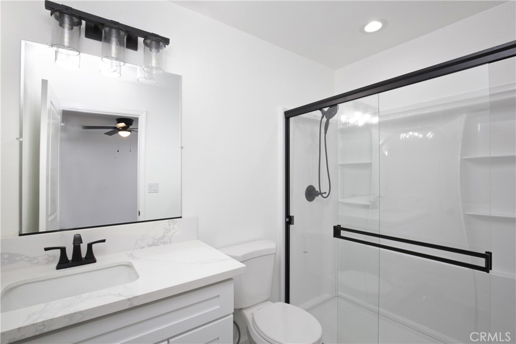 6147 Palm Avenue Riverside, CA 92506 - Photo 11 of 13 a bathroom with a sink toilet and shower