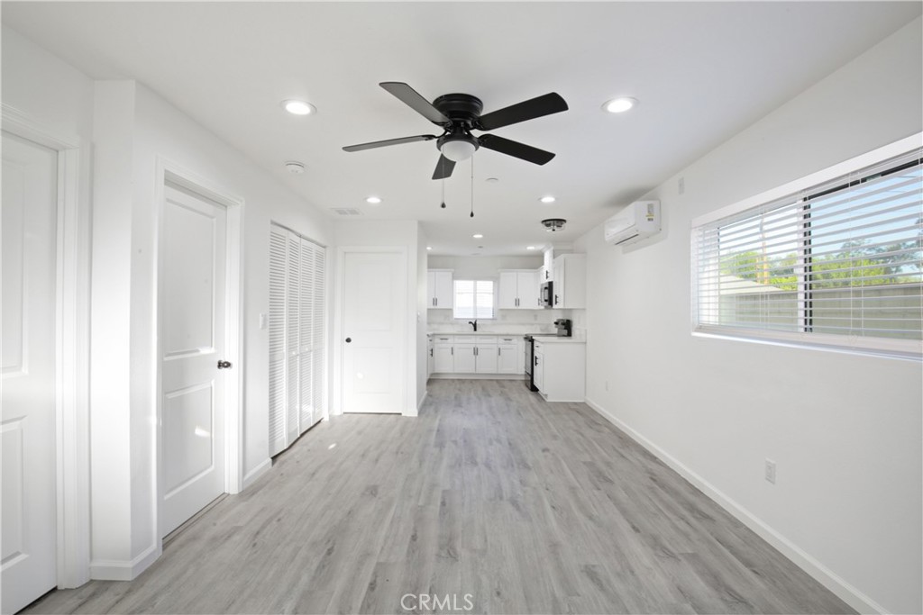 6147 Palm Avenue Riverside, CA 92506 - Photo 5 of 13 a view of a livingroom with a hardwood floor and a ceiling fan