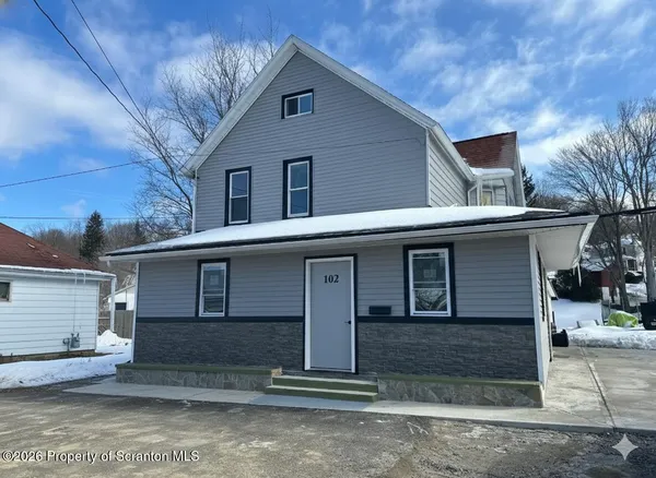 a front view of a house with a garage