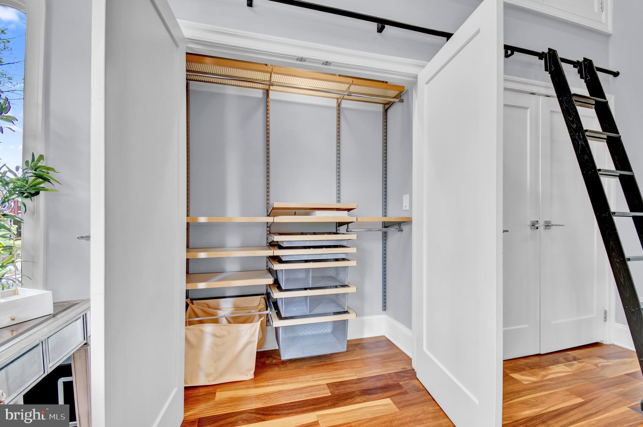 1915 2nd Street Northwest Washington, DC 20001 - Photo 28 of 76 a view of closet area with rug and wooden floor