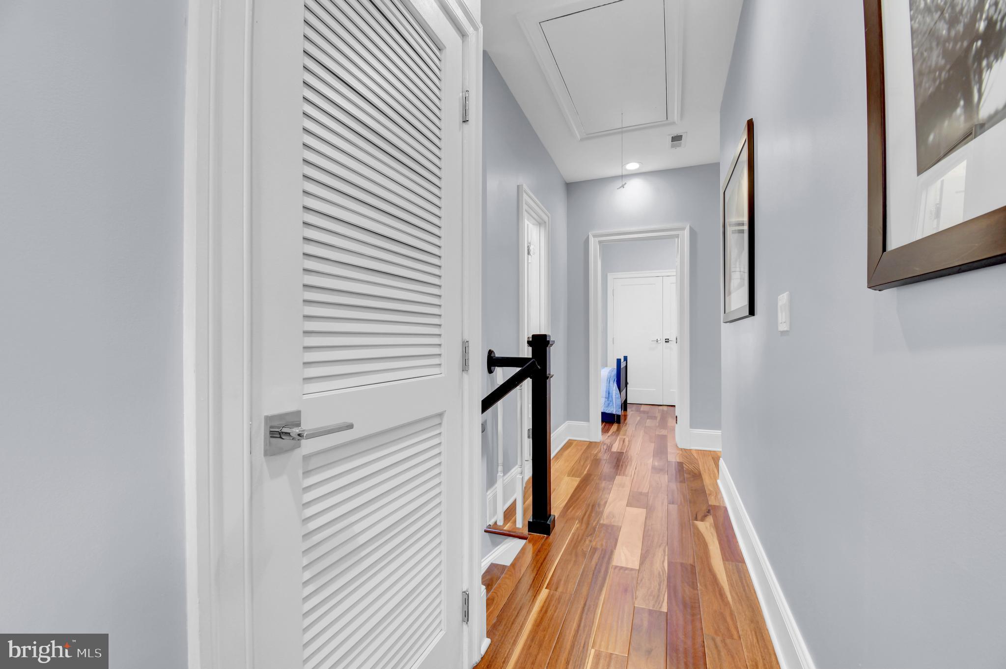 1915 2nd Street Northwest Washington, DC 20001 - Photo 33 of 76 a view of a hallway with wooden floor and a bathroom