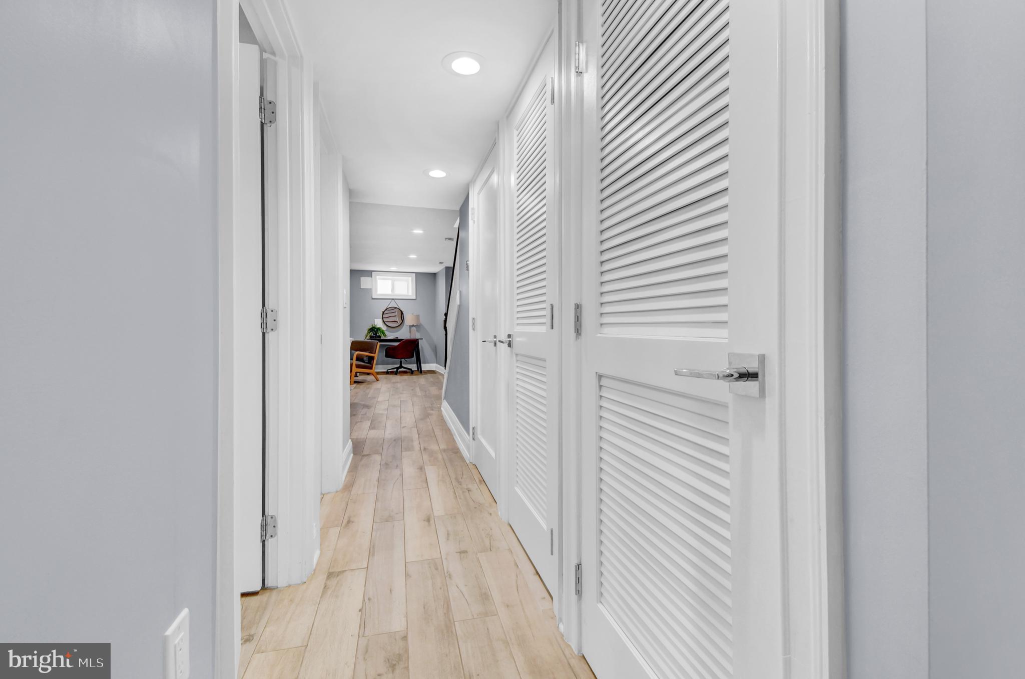 1915 2nd Street Northwest Washington, DC 20001 - Photo 50 of 76 a view of a hallway with wooden floor and a bathroom