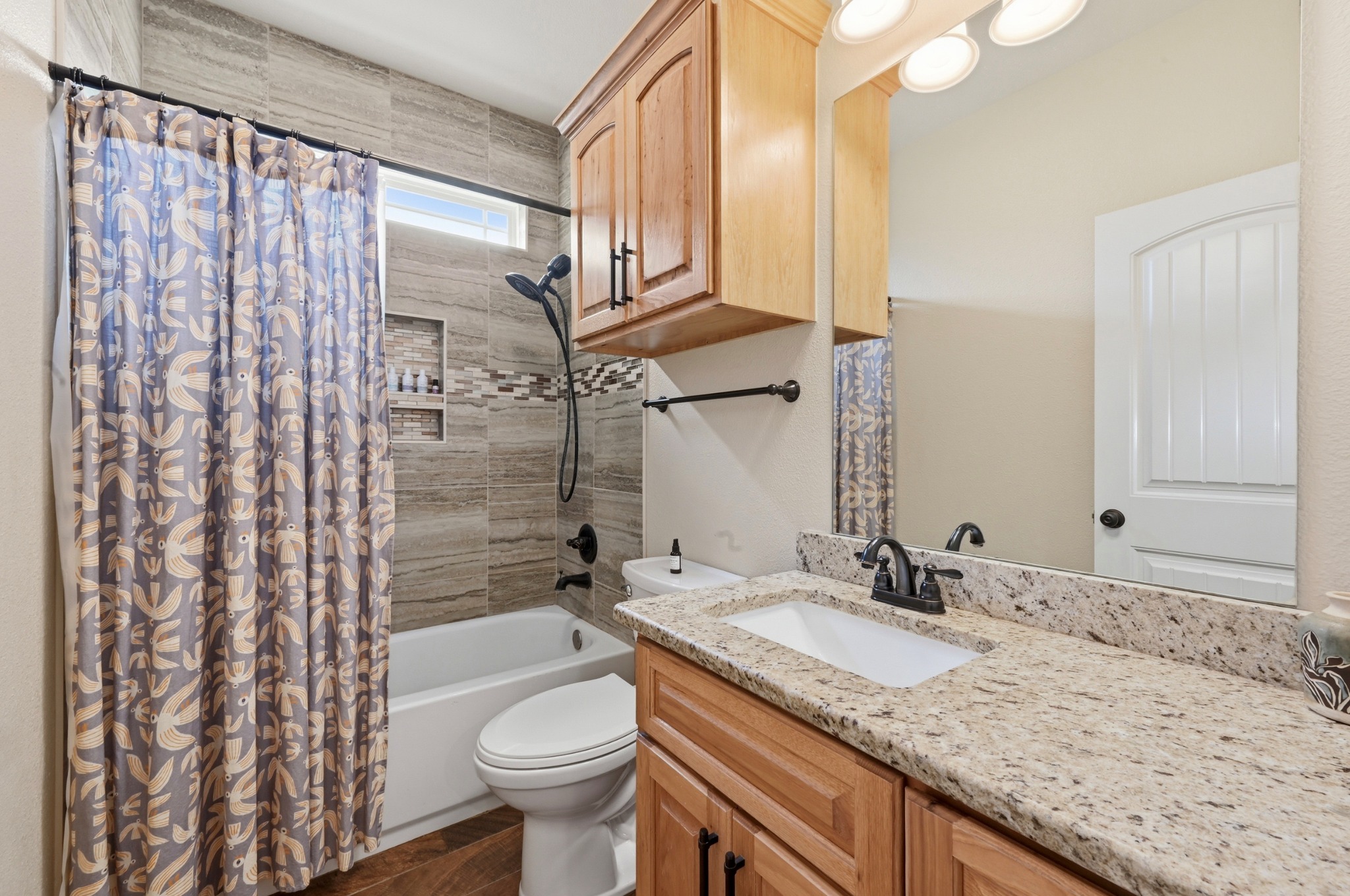 202 Cedar Hills Drive Elgin, TX 78621 - Photo 26 of 37 a bathroom with a granite countertop sink toilet and shower