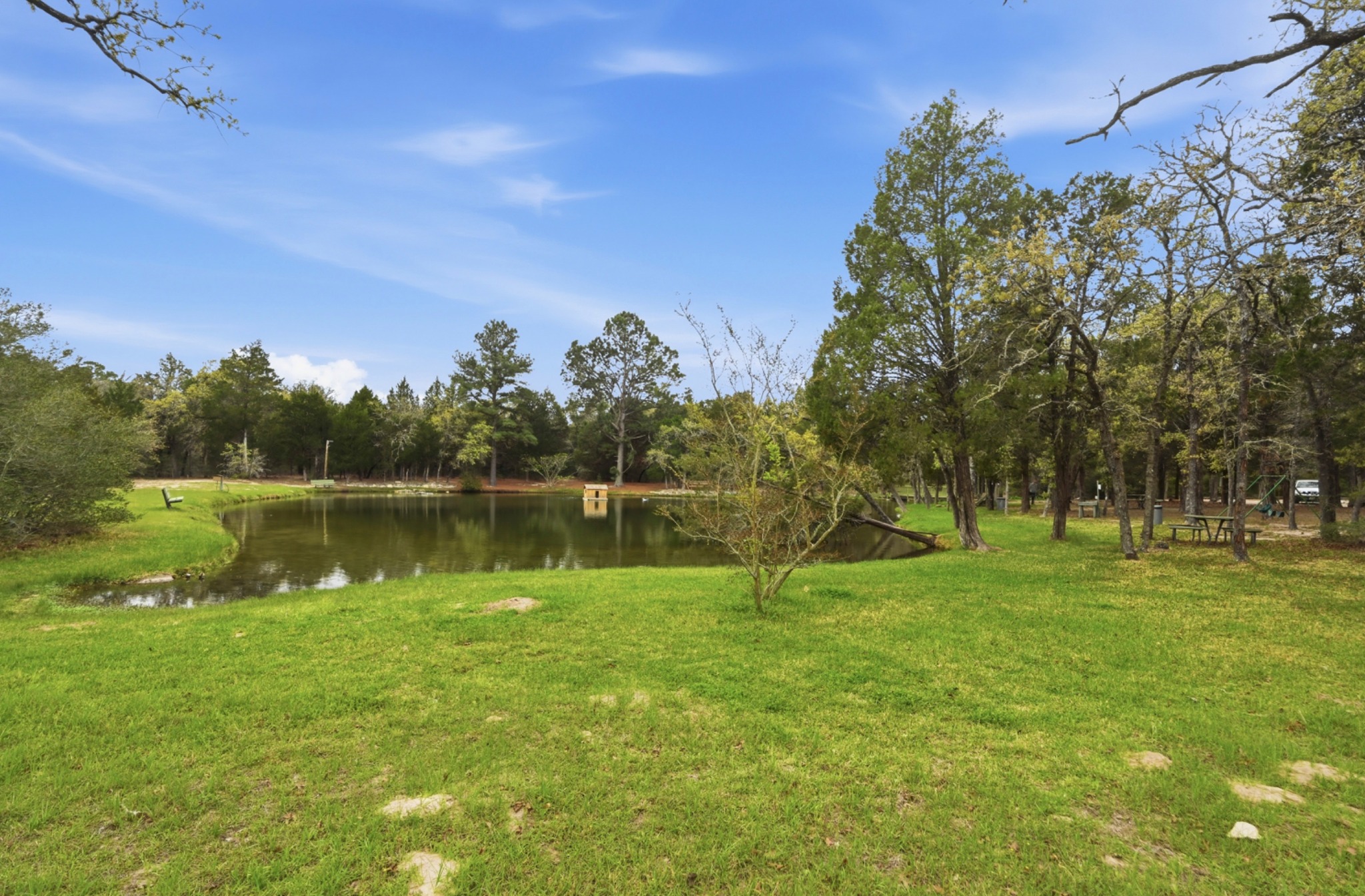202 Cedar Hills Drive Elgin, TX 78621 - Photo 34 of 37 a view of a golf course with a lake