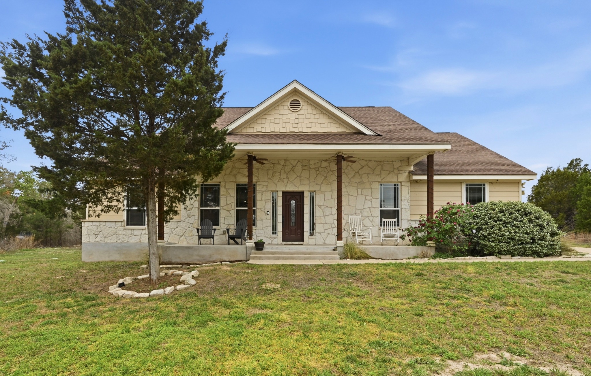202 Cedar Hills Drive Elgin, TX 78621 - Photo 4 of 37 a front view of a house with garden