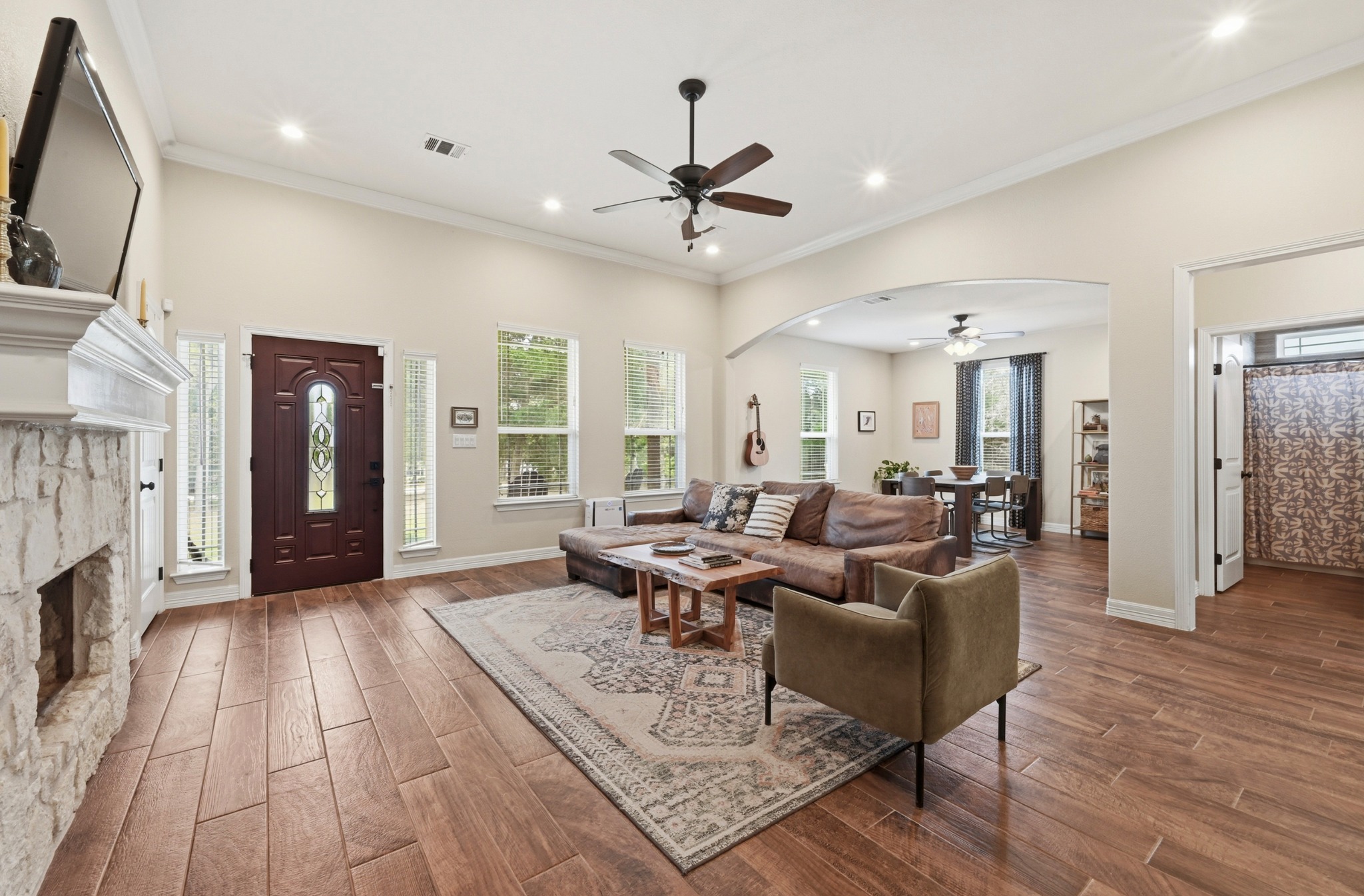 202 Cedar Hills Drive Elgin, TX 78621 - Photo 5 of 37 a living room with furniture and a fireplace