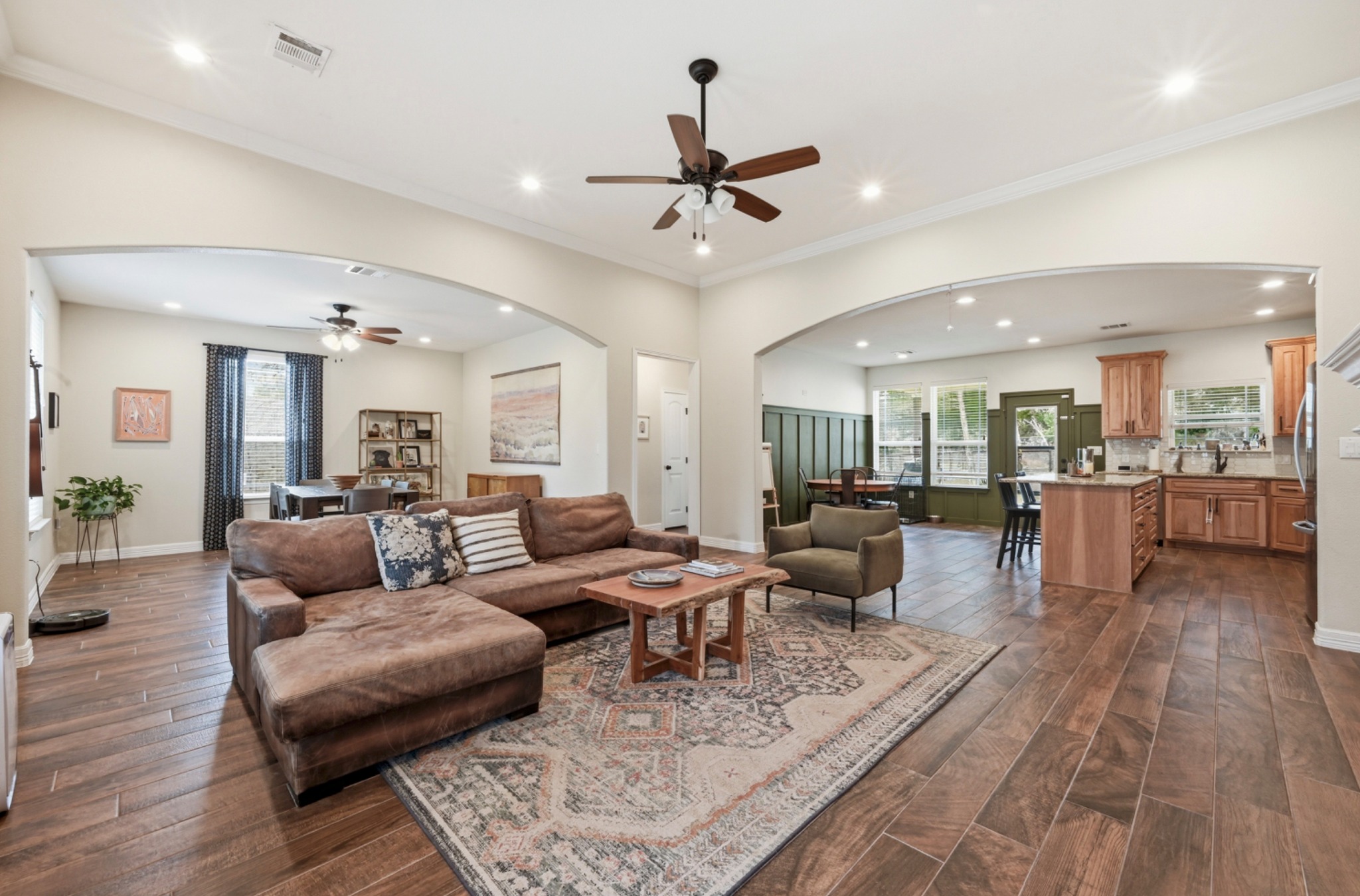 202 Cedar Hills Drive Elgin, TX 78621 - Photo 8 of 37 a living room with furniture or kitchen view and a wooden floor