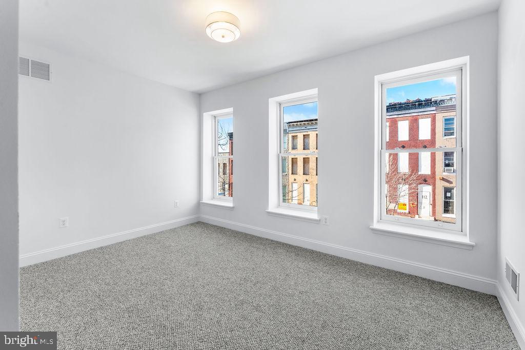 107 South Fulton Avenue Baltimore, MD 21223 - Photo 12 of 36 an empty room with a window