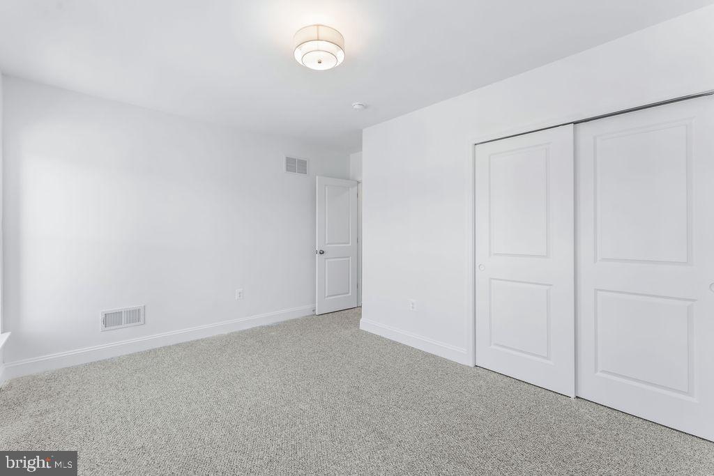 107 South Fulton Avenue Baltimore, MD 21223 - Photo 21 of 36 a view of an empty room
