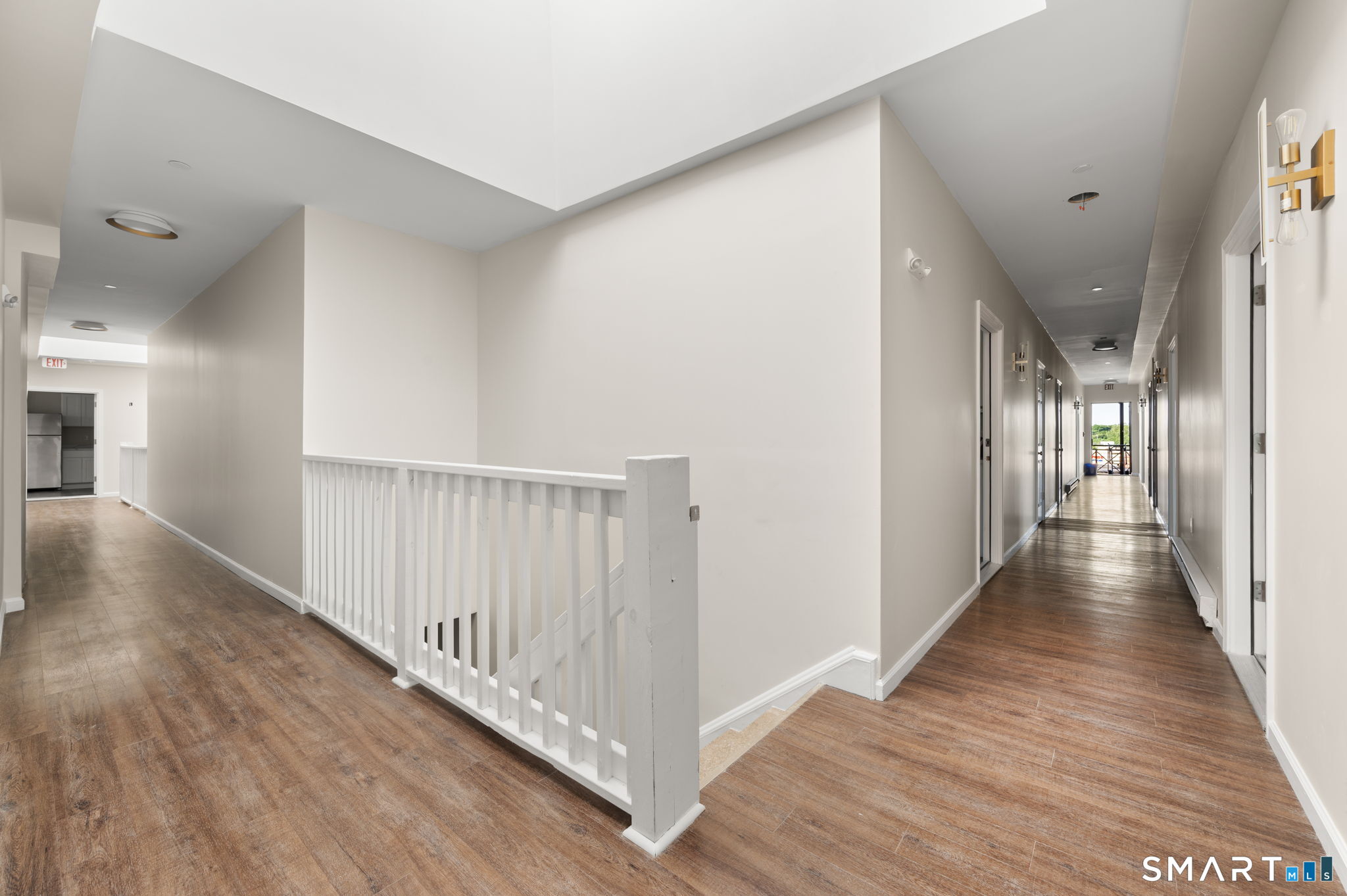 27 Main Street, Unit 6 New Britain, CT 06051 - Photo 6 of 6 a view of a hallway with wooden floor