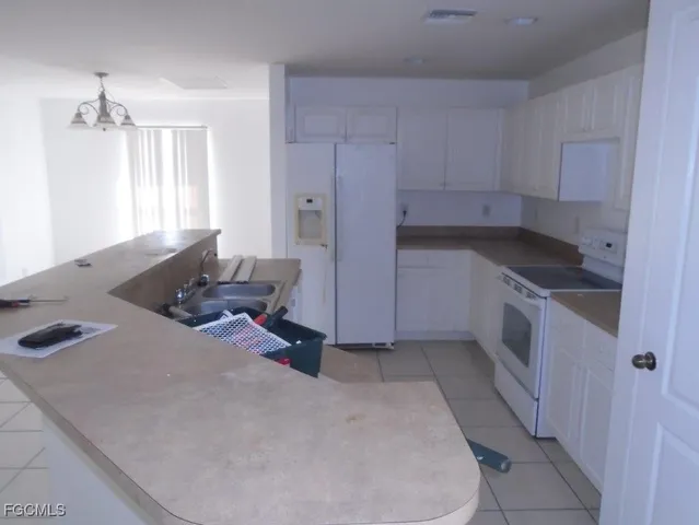 a kitchen with a sink and cabinets