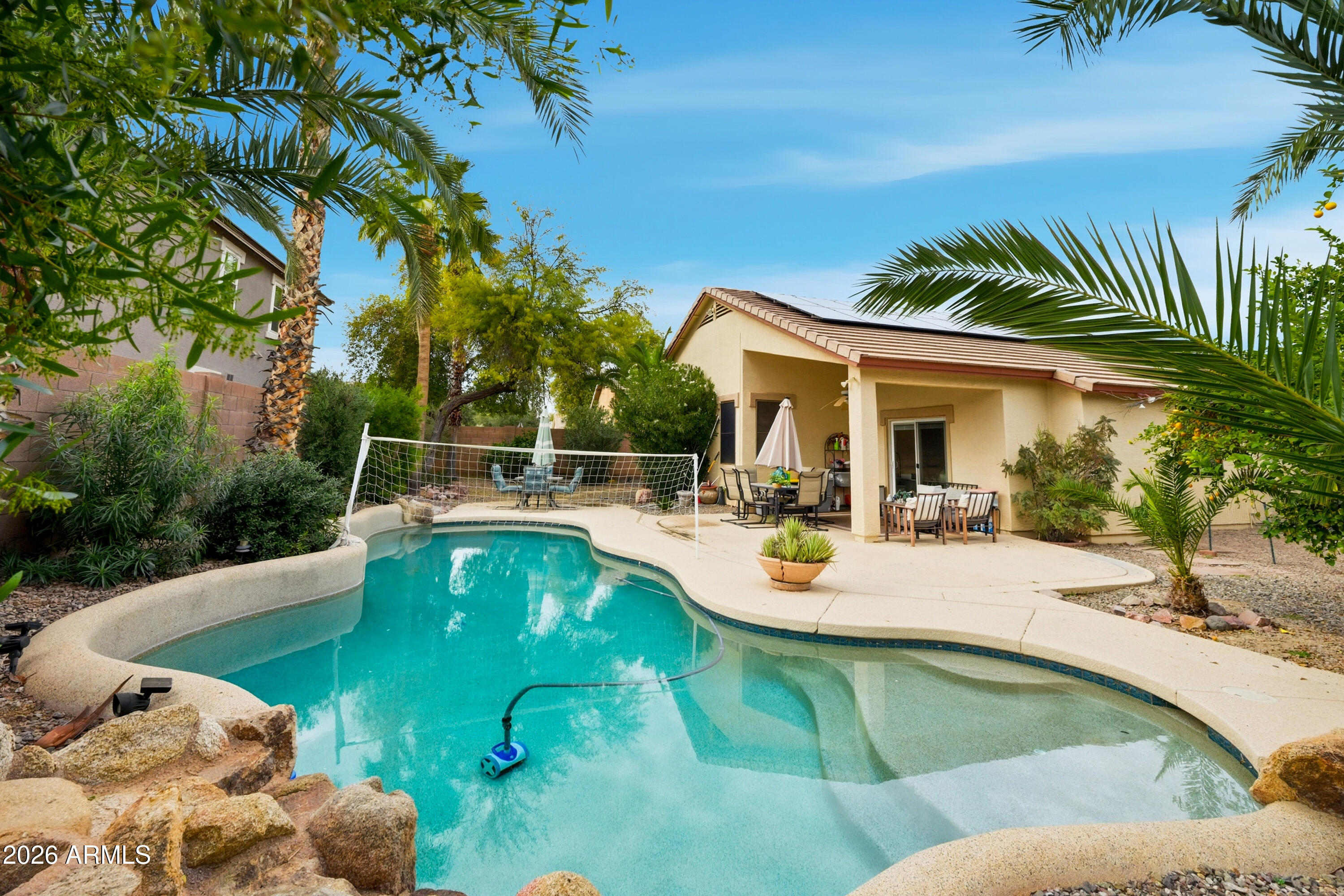 4210 South Splendor Place Gilbert, AZ 85297 - Photo 1 of 38 a view of a swimming pool with a patio