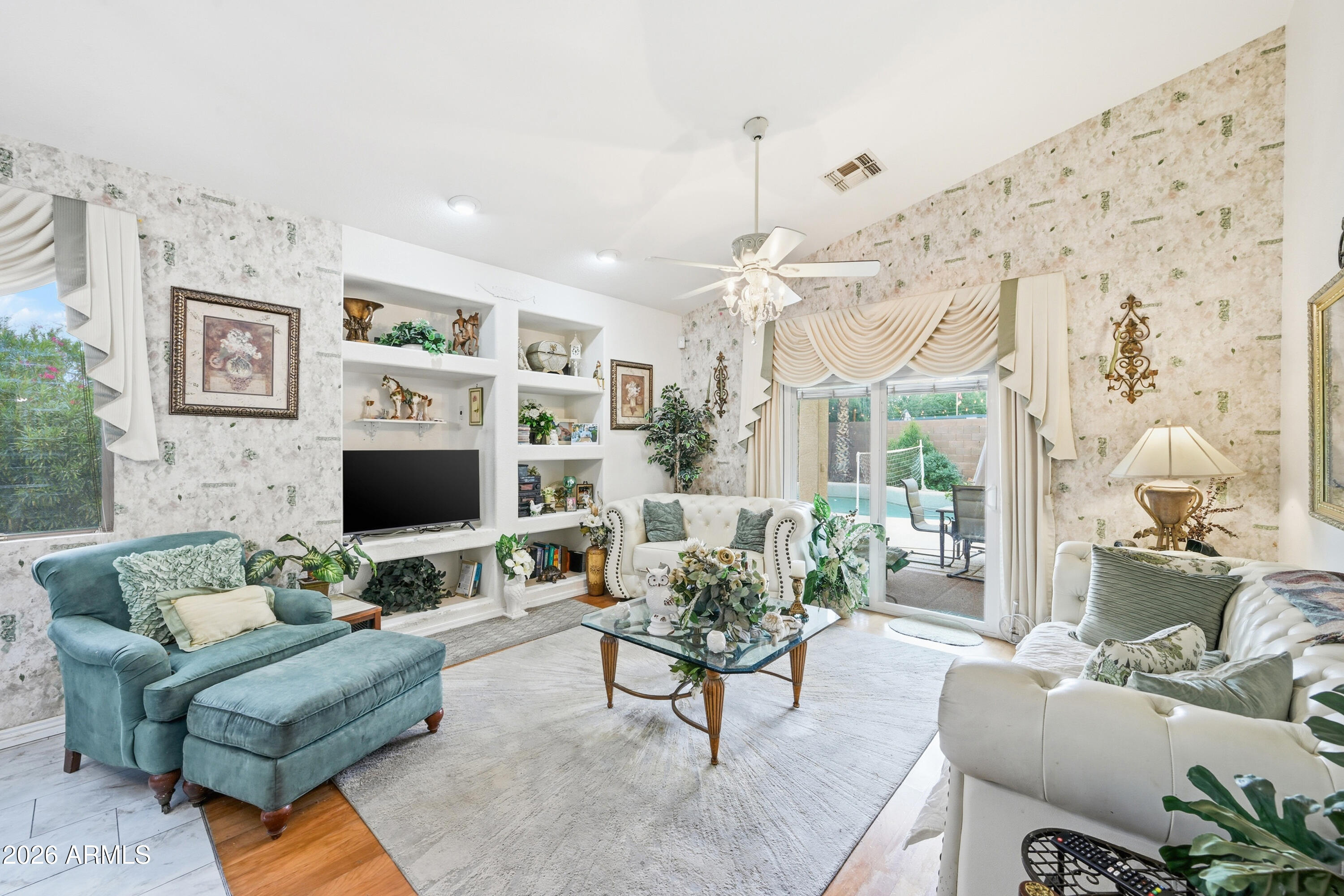4210 South Splendor Place Gilbert, AZ 85297 - Photo 11 of 38 a living room with furniture and a flat screen tv