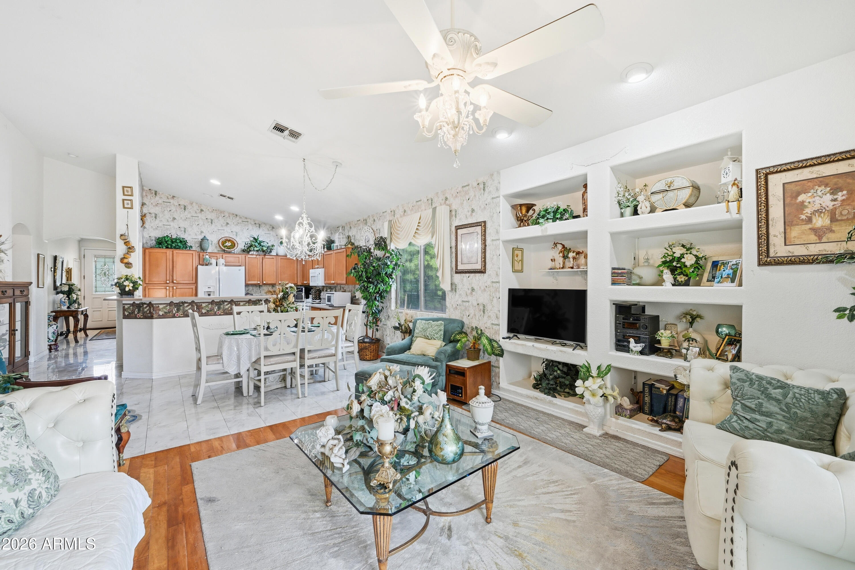 4210 South Splendor Place Gilbert, AZ 85297 - Photo 12 of 38 a living room with furniture a rug and a flat screen tv