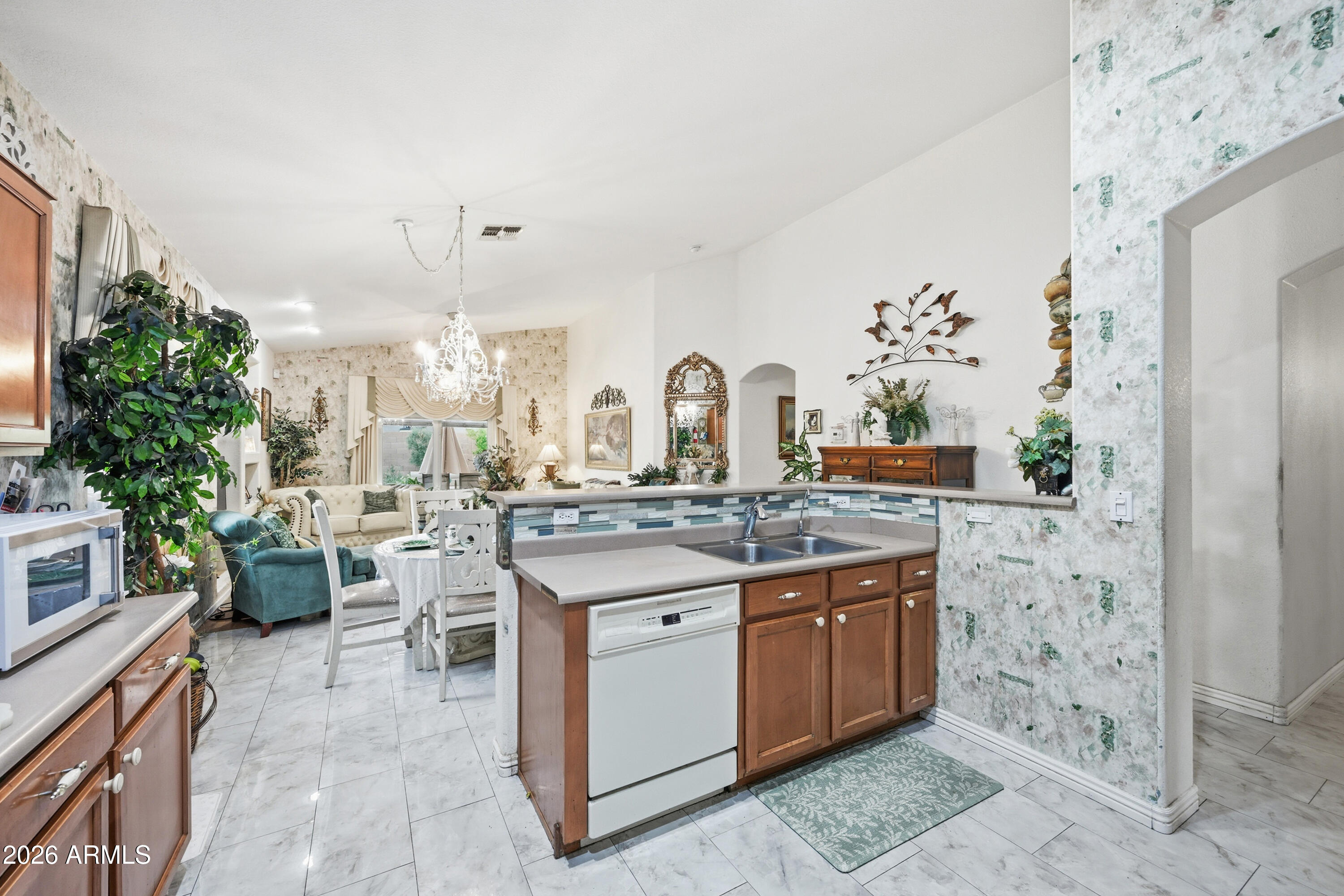 4210 South Splendor Place Gilbert, AZ 85297 - Photo 14 of 38 a kitchen with a sink stove and cabinets