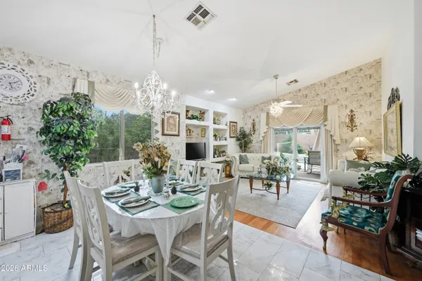 a view of a dining room with furniture window and outside view