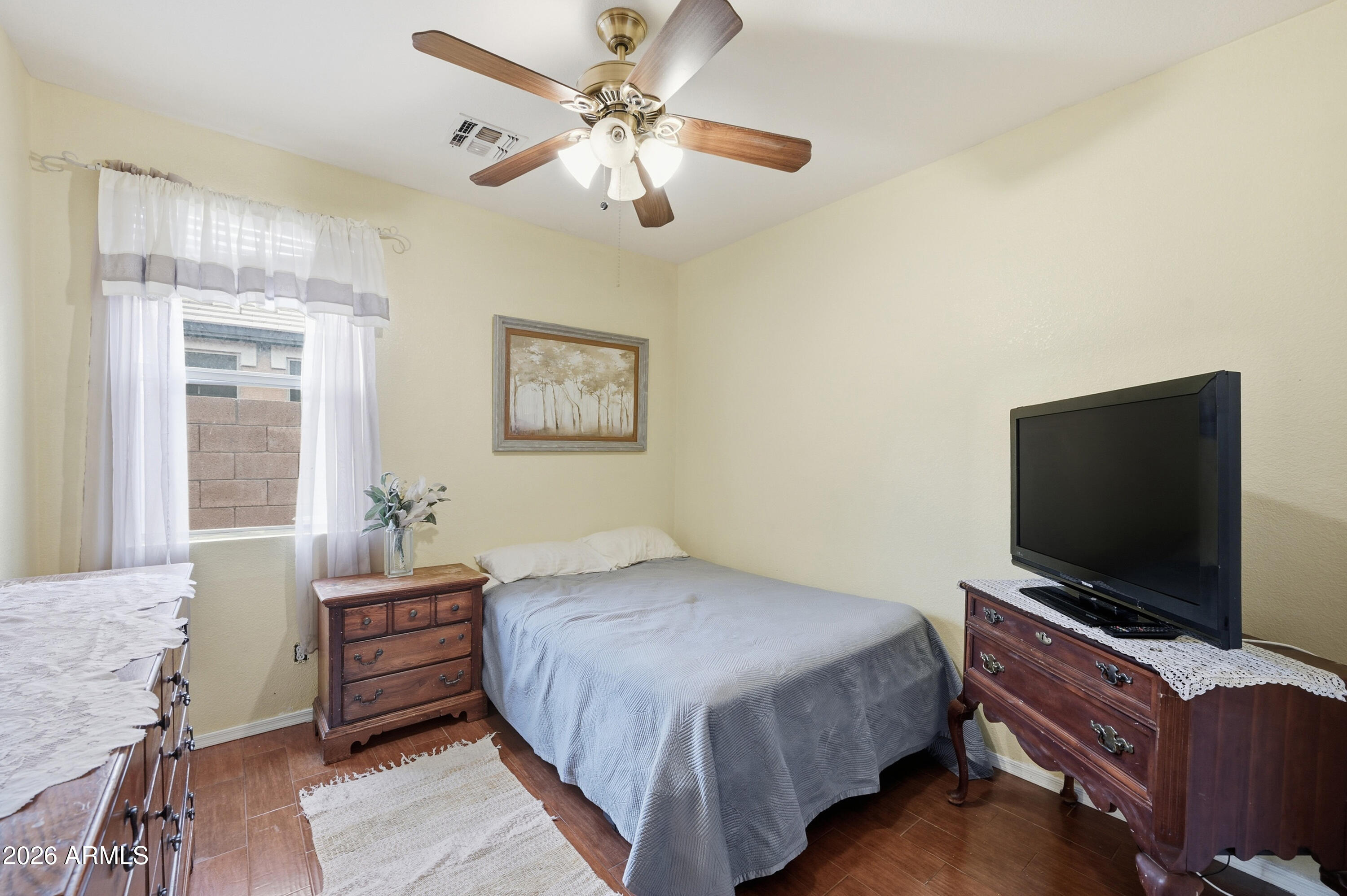 4210 South Splendor Place Gilbert, AZ 85297 - Photo 18 of 38 a bedroom with a bed and a flat screen tv