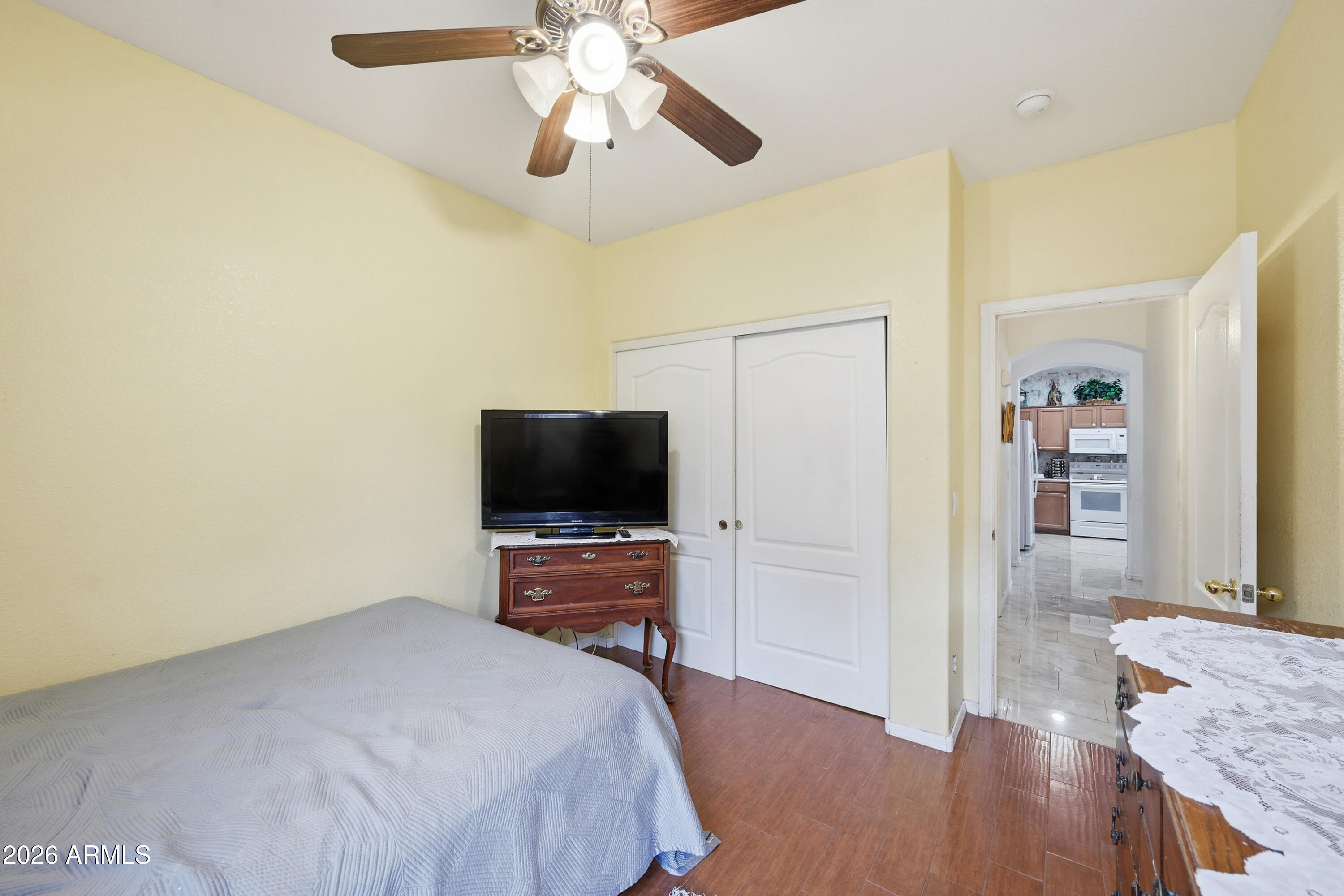 4210 South Splendor Place Gilbert, AZ 85297 - Photo 19 of 38 a bedroom with a bed and a flat screen tv