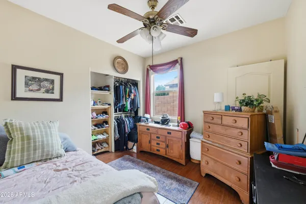 a bed room with a bed and a dresser