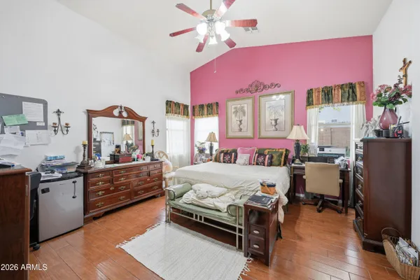 a bedroom with a bed and a chandelier