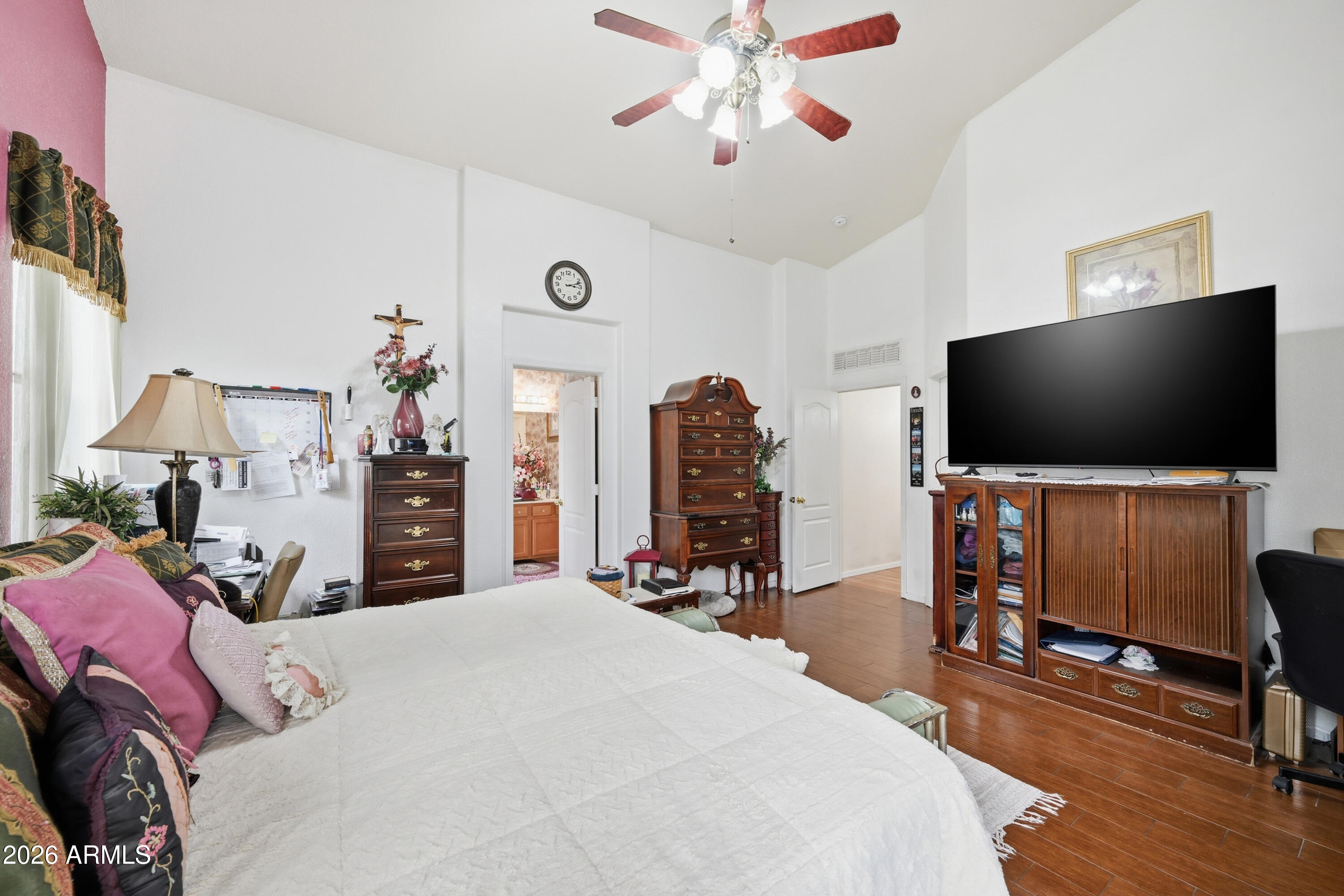 4210 South Splendor Place Gilbert, AZ 85297 - Photo 25 of 38 a bedroom with a bed and a flat screen tv