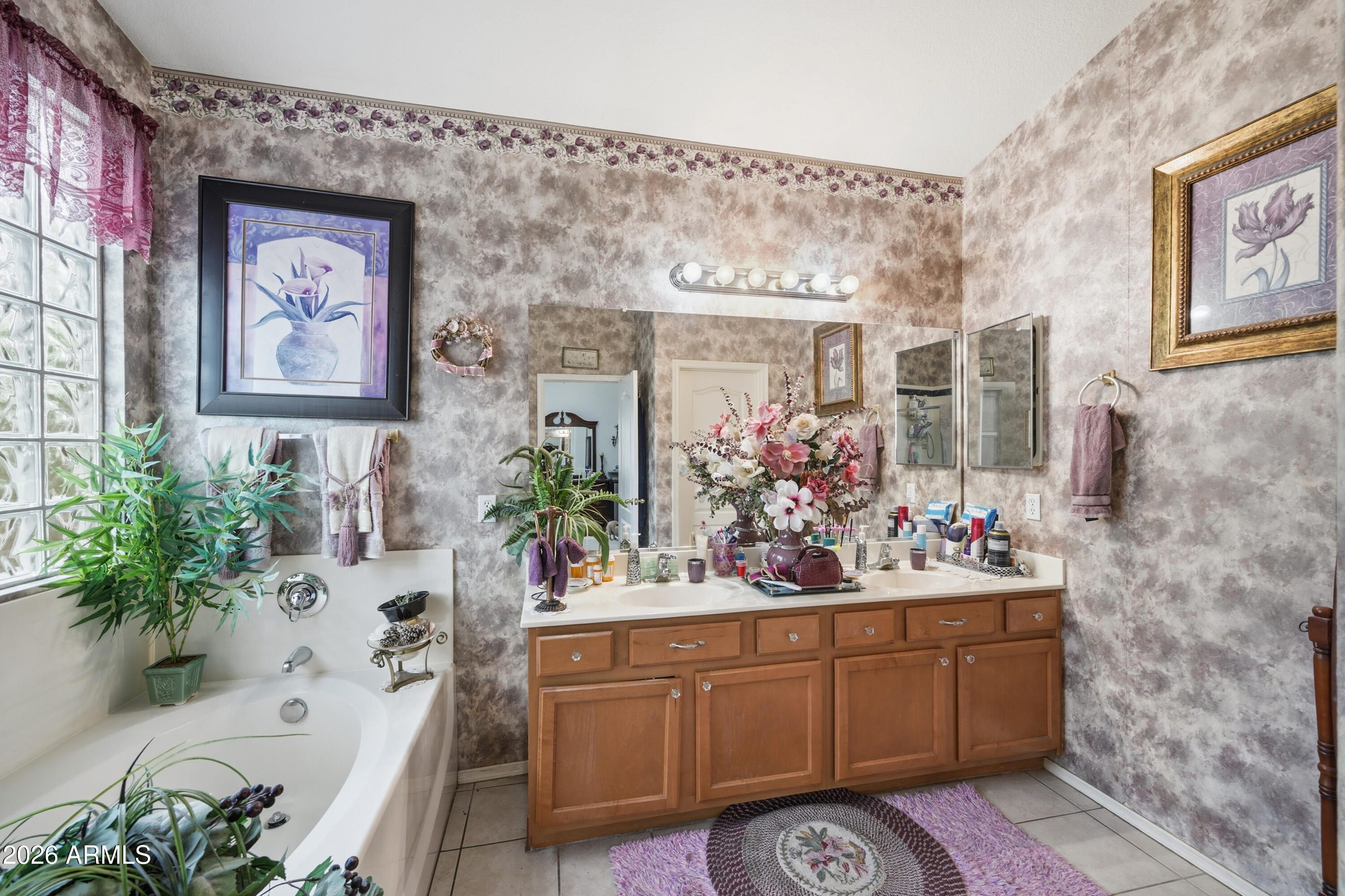 4210 South Splendor Place Gilbert, AZ 85297 - Photo 28 of 38 a bathroom with a sink mirror and vanity