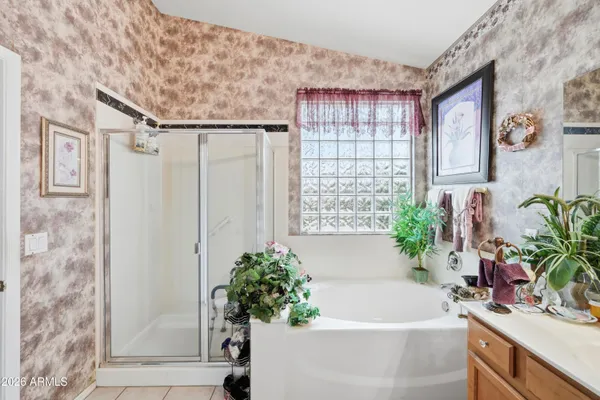 a white bath tub sitting next to a white sink