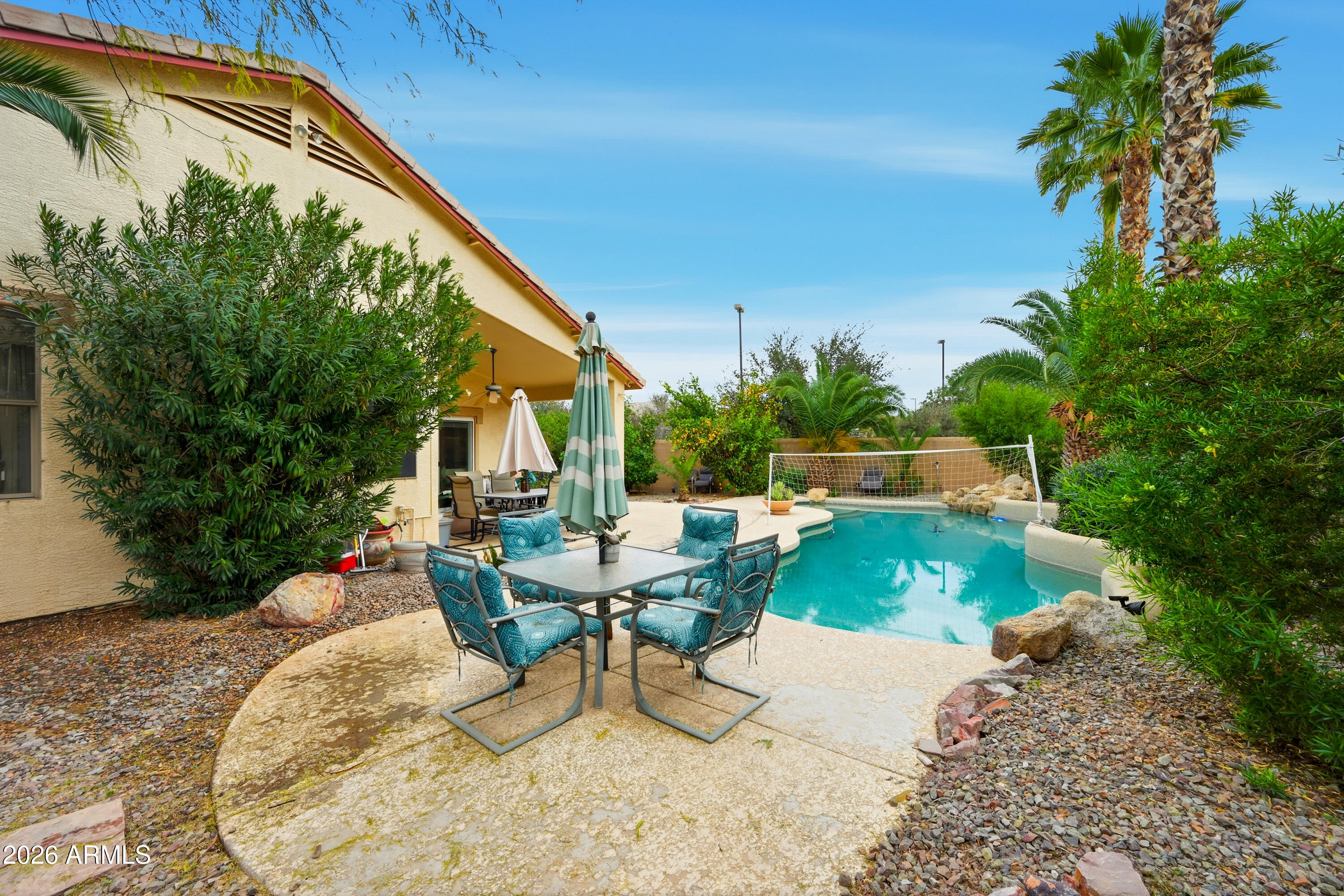 4210 South Splendor Place Gilbert, AZ 85297 - Photo 30 of 38 a view of backyard with swimming pool and outdoor seating