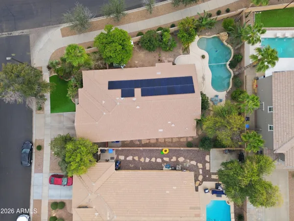 an aerial view of residential houses with outdoor space