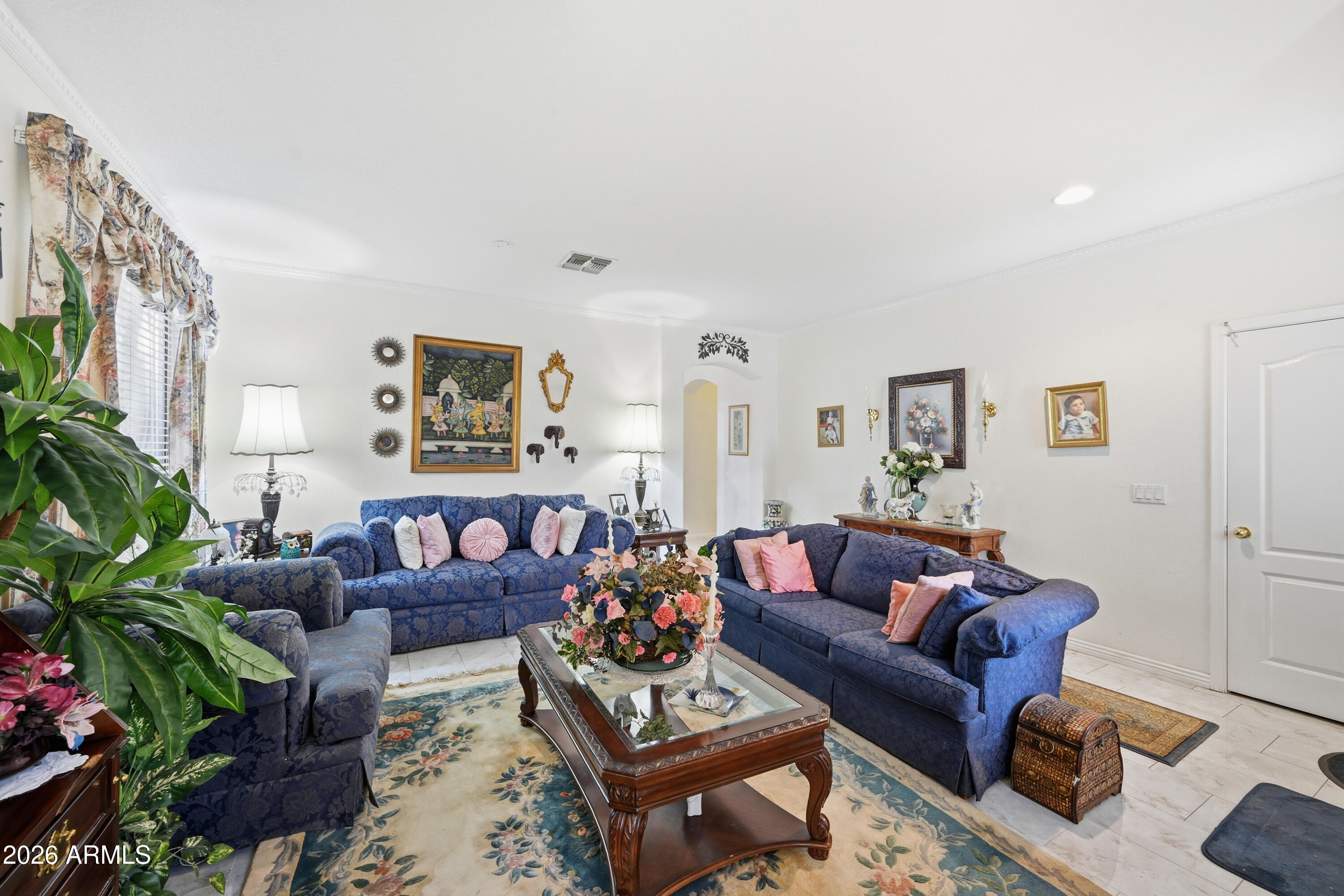 4210 South Splendor Place Gilbert, AZ 85297 - Photo 9 of 38 a living room with furniture or couch and a potted plant