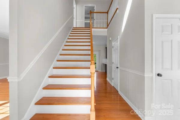 a view of entryway with wooden floor