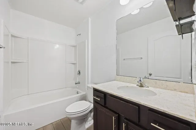 a bathroom with a sink a toilet and a bathtub