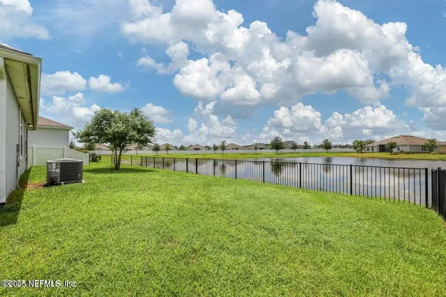 a view of a garden with a building in the background