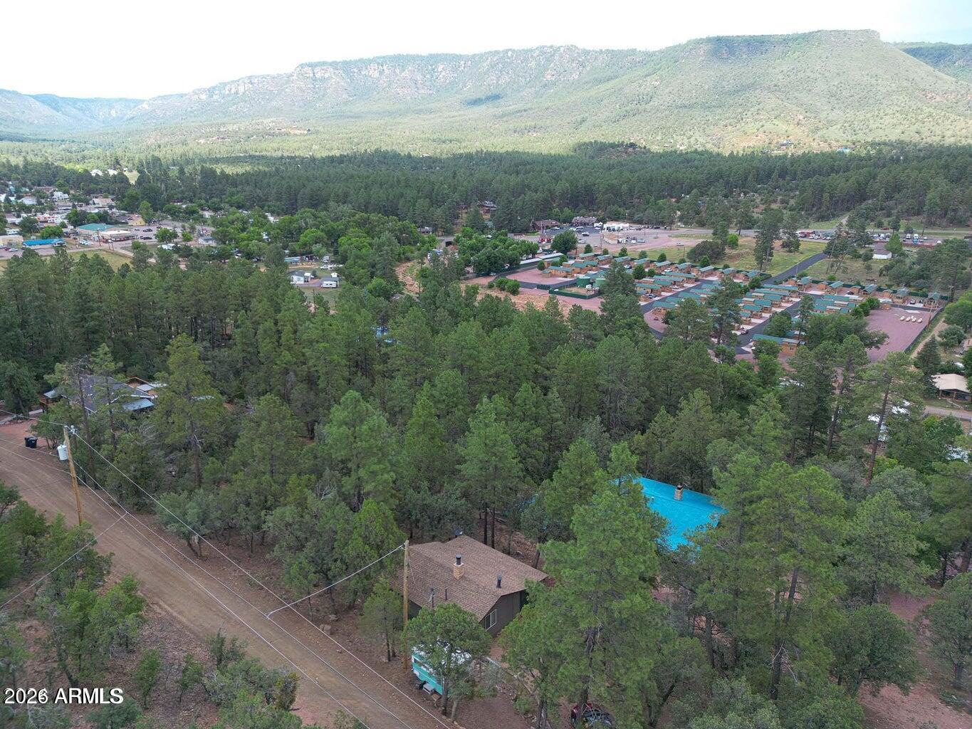3483 Hillside Road Pine, AZ 85544 - Photo 42 of 54 an aerial view of house with yard and mountain view in back