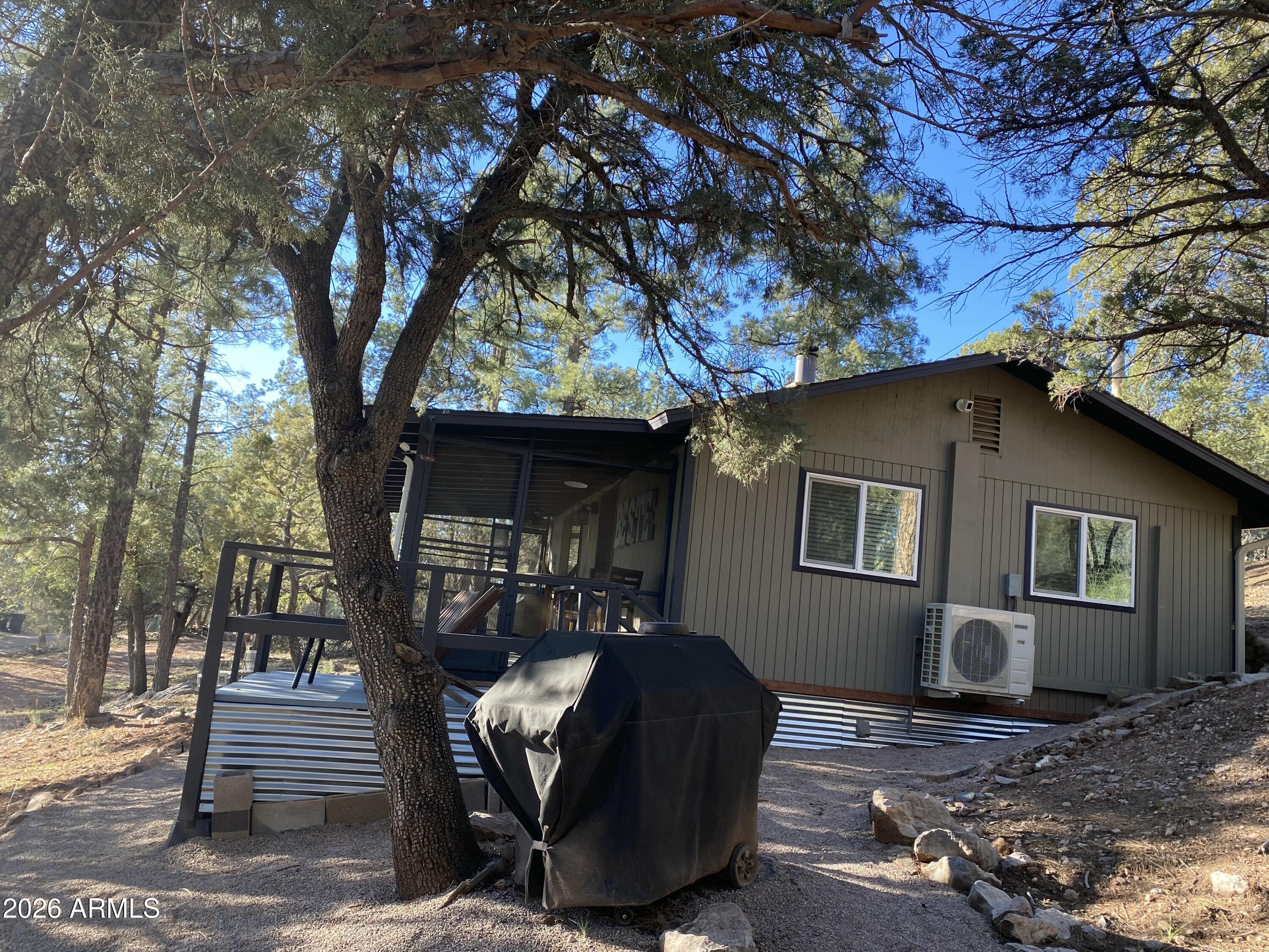 3483 Hillside Road Pine, AZ 85544 - Photo 51 of 54 a front view of a house with garden