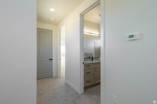 2972 West 570 North Hurricane, UT 84737 - Photo 71 of 104 Corridor with light colored carpet and baseboards