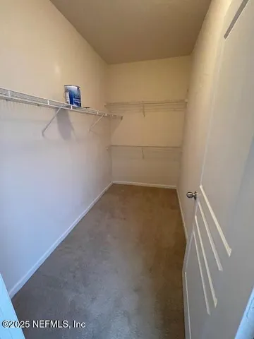 a view of a room with racks on the wall