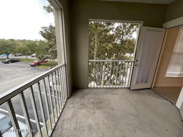 a view of a porch with furniture