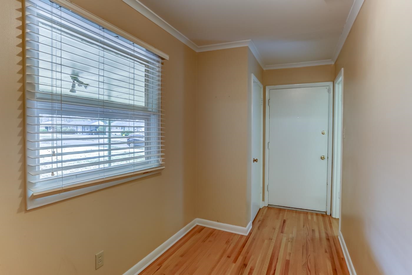 1542 Dearing Road Memphis, TN 38117 - Photo 3 of 25 a view of a room with wooden floor and a window