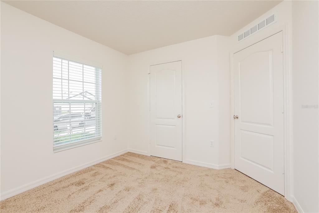 1668 Gopher Tree Street Mascotte, FL 34753 - Photo 11 of 16 an empty room with windows