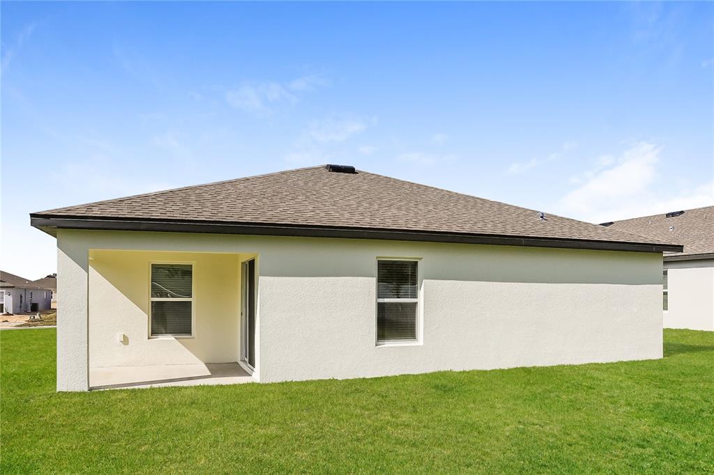 1668 Gopher Tree Street Mascotte, FL 34753 - Photo 14 of 16 a front view of house with yard