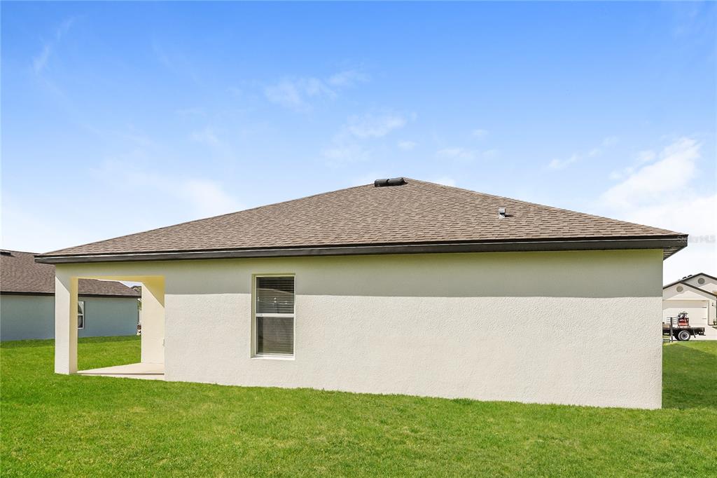1668 Gopher Tree Street Mascotte, FL 34753 - Photo 15 of 16 a front view of a house with garden