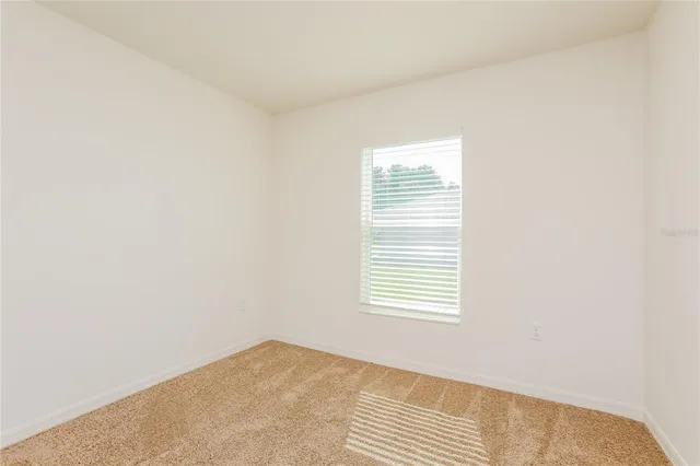 a view of a room that has a window in it