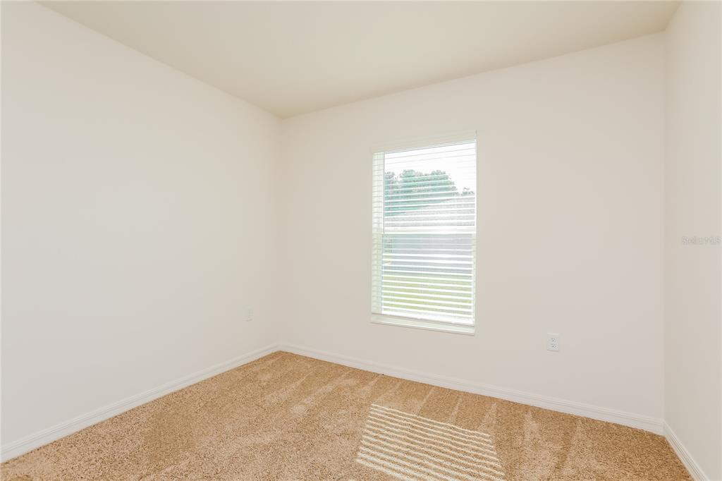 1668 Gopher Tree Street Mascotte, FL 34753 - Photo 9 of 16 a view of a room that has a window in it