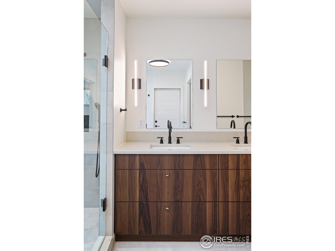 2125 Upland Avenue Boulder, CO 80304 - Photo 17 of 36 a bathroom with a sink and a mirror