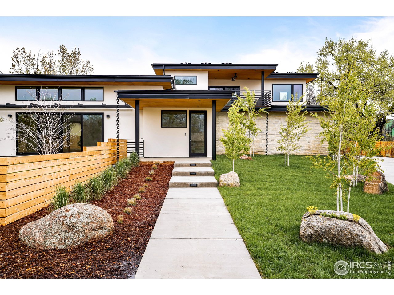 2125 Upland Avenue Boulder, CO 80304 - Photo 2 of 36 a front view of a house with garden