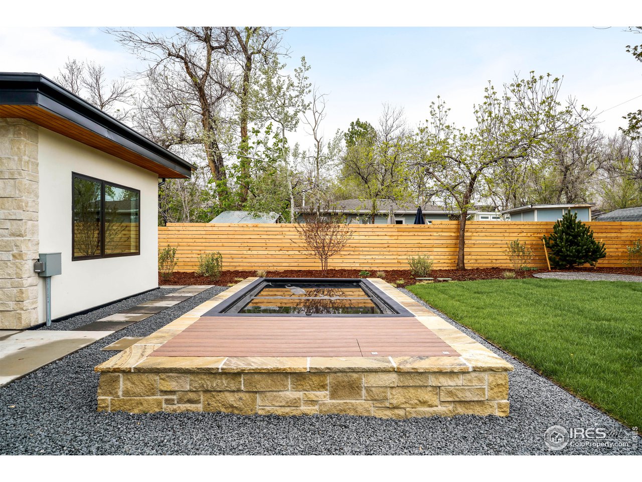 2125 Upland Avenue Boulder, CO 80304 - Photo 27 of 36 a white house with trees in front of it
